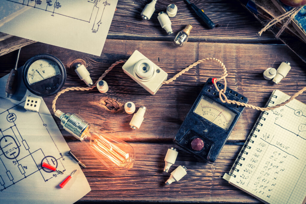 Table filled with tools for inventing and tinkering.